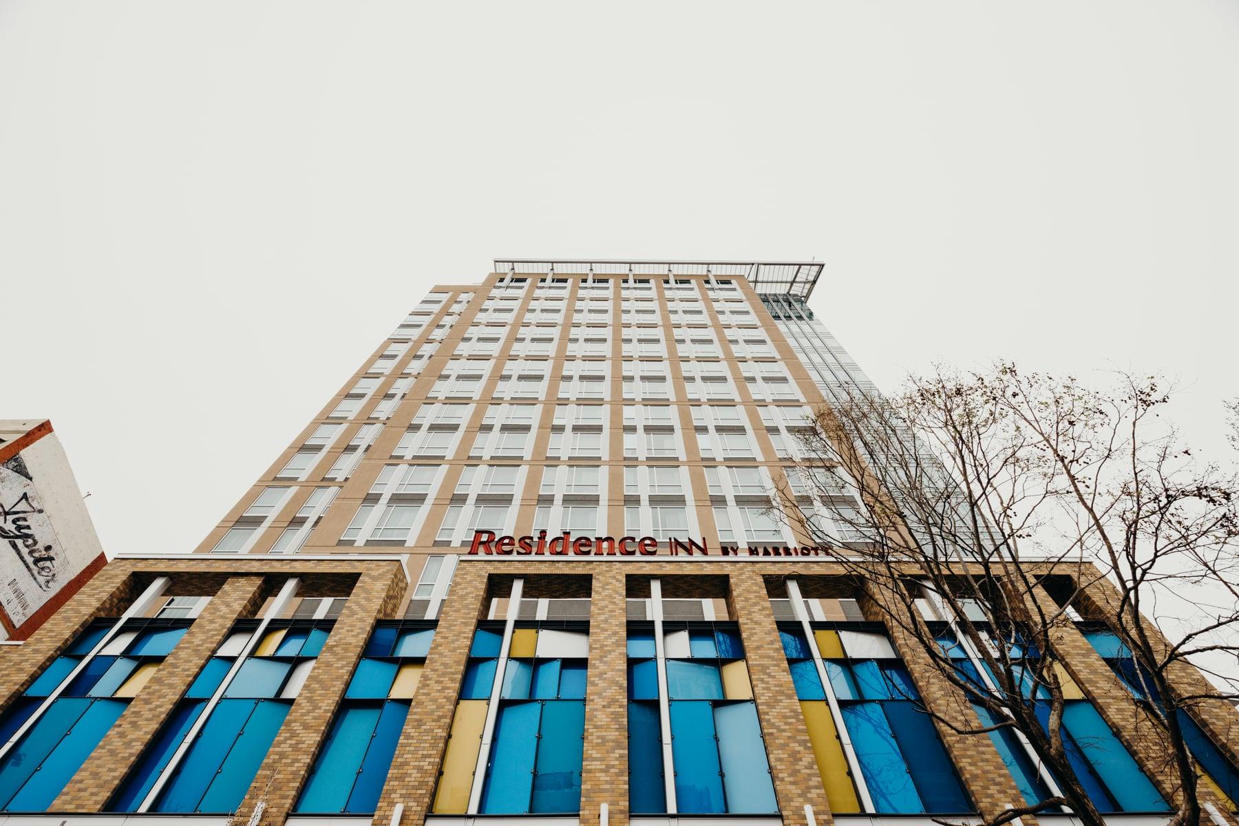 Residence Inn by Marriott tower in Berkeley, with a brick base and blue and yellow glazing panels