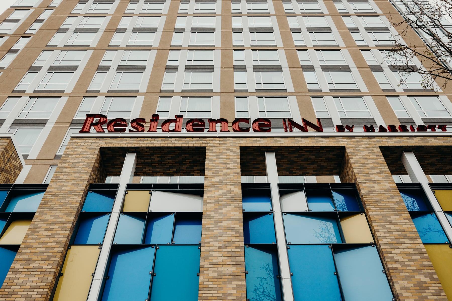 Close view of blue and yellow glazing panels at the base of The Berkeley Hotel (Residence Inn) in Berkeley, CA, glazed by USGA Inc.