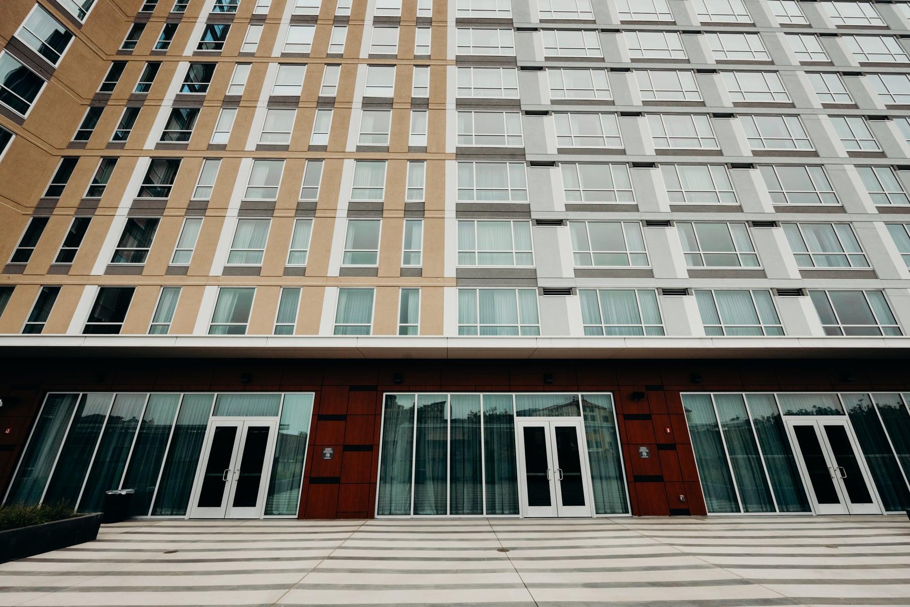 Ground-floor glass doors and storefront at the base of the Residence Inn tower