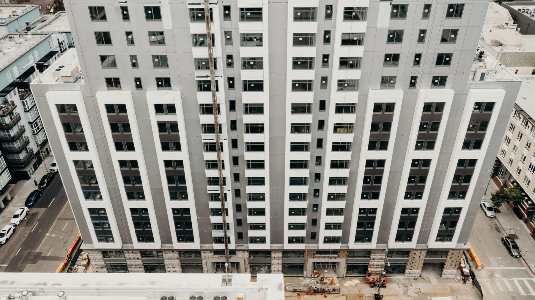 Oakland Marriott hotel tower from above, rising over a construction site